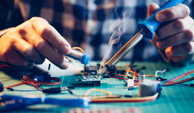 engineer-soldering-a-motherboard